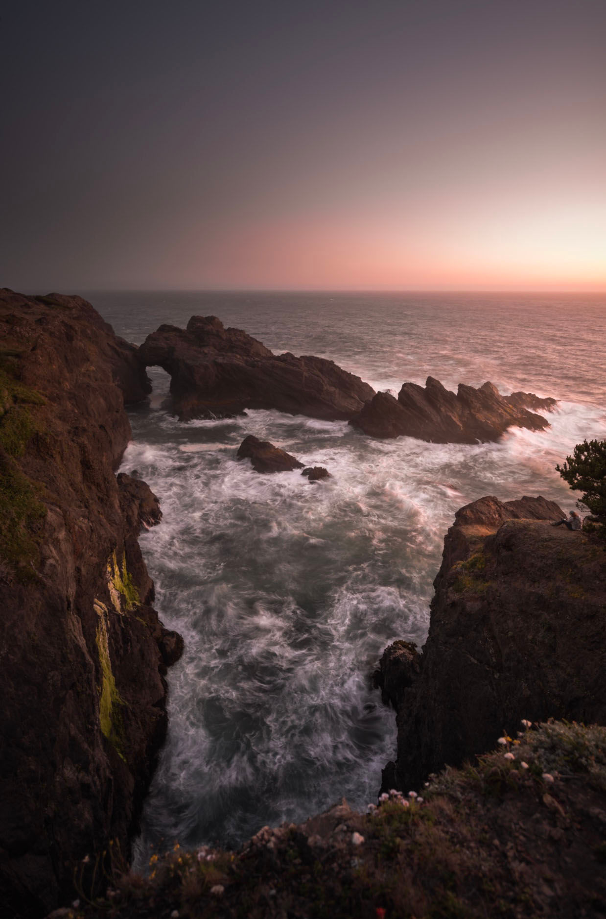 Golden evening light above a rugged Oregon coastline