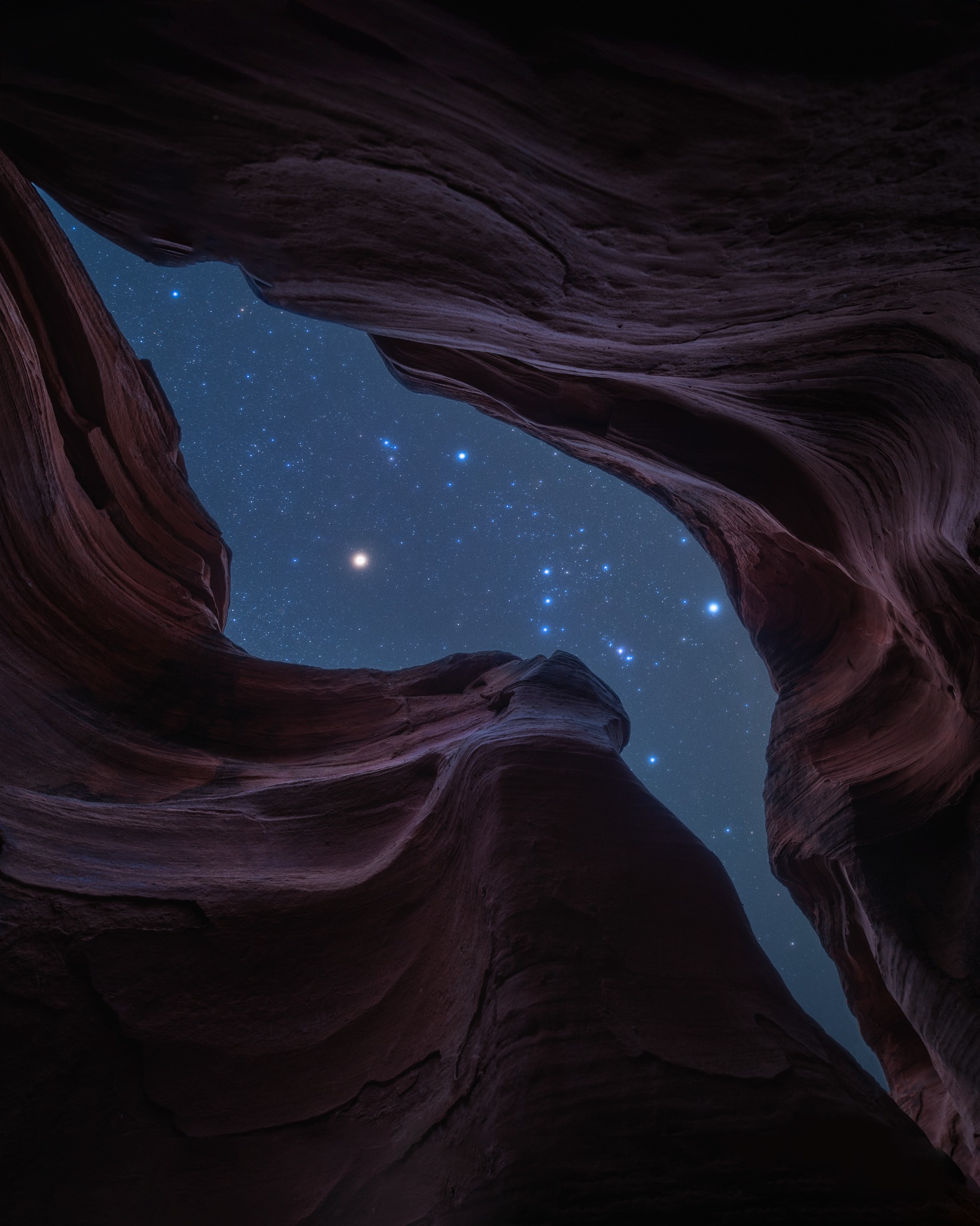 Orion above a Utah slot canyon, photographed by Ryan T. Oswald