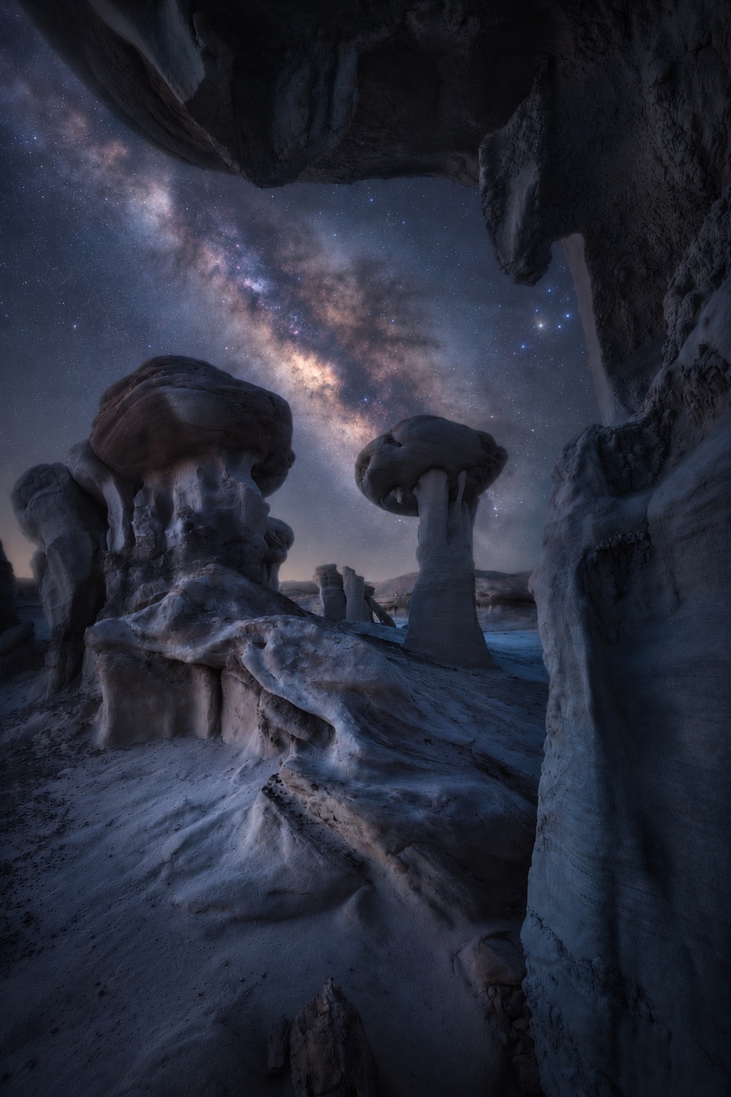The Milky Way framed by shadowed Bisti hoodoos