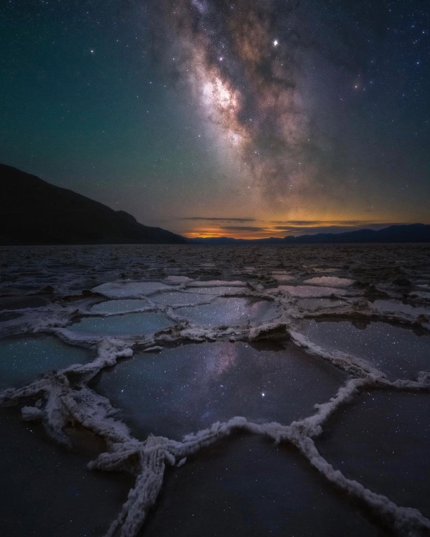 Milky Way above Death Valley salt polygons and reflective pools